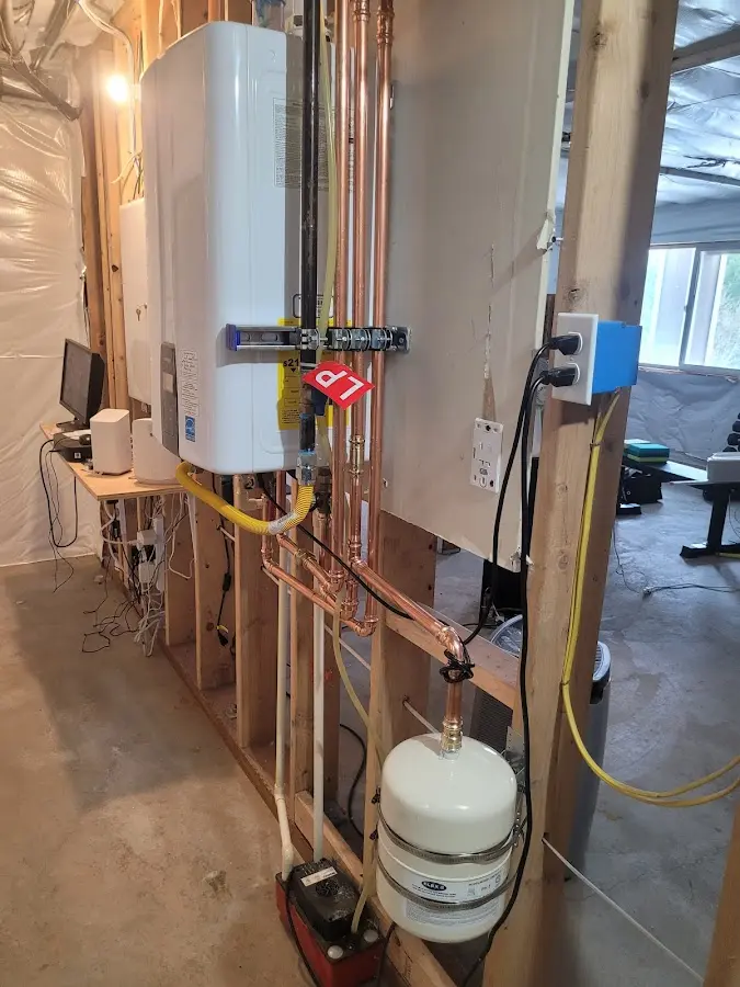 Licensed plumber repairing a kitchen sink in Huntertown